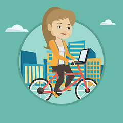 Image showing Woman riding bicycle in the city.