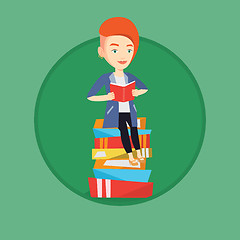 Image showing Student sitting on huge pile of books.