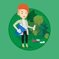 Image showing Woman collecting garbage in forest.