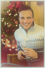 Image showing Happy young man with a glass of champagne