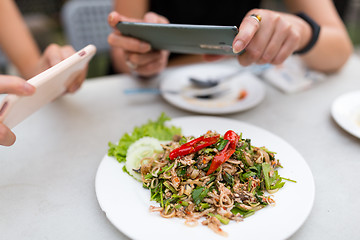 Image showing People taking photo on food with mobile phone