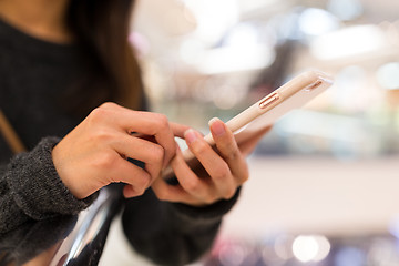 Image showing Woman wokring on mobile phone