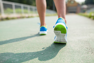 Image showing Woman training marathon in a city 