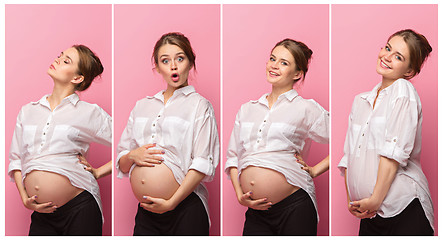 Image showing Young beautiful pregnant woman standing on pink background