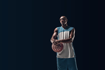 Image showing The portrait of a basketball player with ball