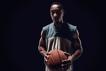 Image showing The portrait of a basketball player with ball