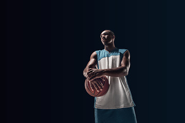 Image showing The portrait of a basketball player with ball