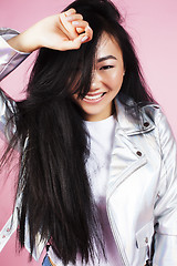 Image showing young pretty stylish hipster asian girl posing emotional isolated on pink background happy smiling cool smile, lifestyle people concept close up