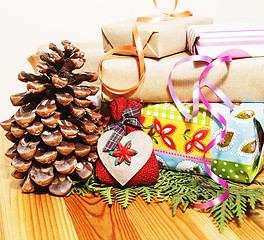 Image showing lot of stuff for handmade gifts, scissors, ribbon, paper with countryside pattern, ready for holiday concept, nobody home 