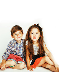 Image showing little cute boy and girl hugging playing on white background, ha