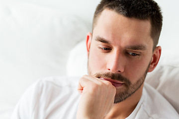 Image showing close up of man in bed thinking