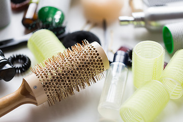 Image showing curling hair brush, styling spray and curlers