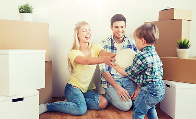 Image showing happy family moving to new home and playing ball