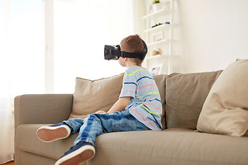 Image showing little boy in vr headset or 3d glasses at home