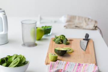 Image showing green fruits and vegetables on kitchen table