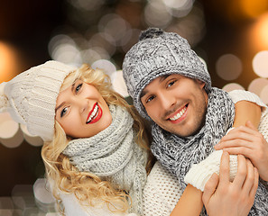 Image showing happy couple hugging over christmas lights