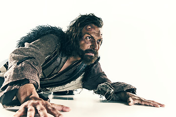 Image showing Portrait of a brutal bald-headed viking in a battle mail posing against a white background.