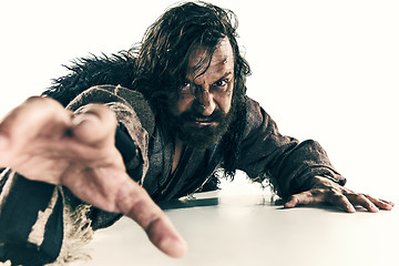 Image showing Portrait of a brutal bald-headed viking in a battle mail posing against a white background.