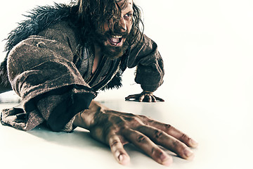 Image showing Portrait of a brutal bald-headed viking in a battle mail posing against a white background.