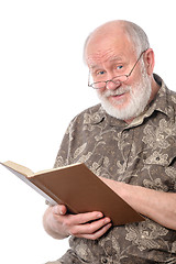 Image showing Senior man reading a book, isolated on white