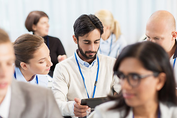 Image showing team with tablet pc at business conference