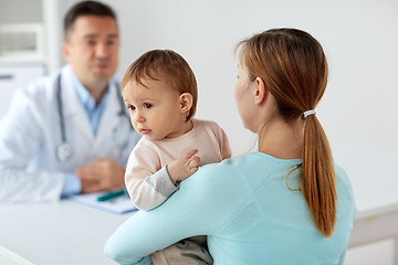 Image showing happy woman with baby and doctor at clinic