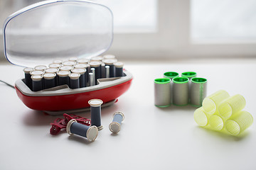 Image showing hair curlers and hot rollers kit on table