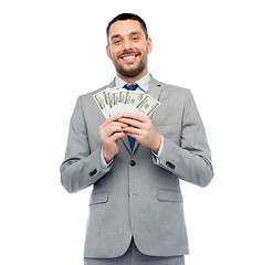 Image showing smiling businessman with american dollar money