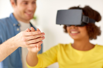 Image showing happy couple with virtual reality headset at home