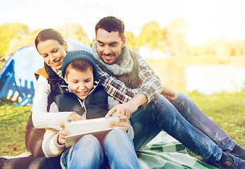 Image showing happy family with tablet pc and tent at camp site