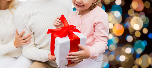 Image showing happy family at home with christmas gift box