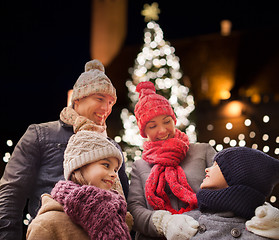 Image showing happy family outdoors at christmas eve