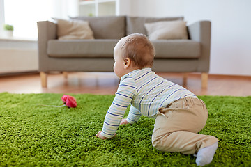 Image showing baby boy crawling on floor at home