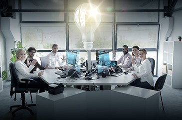 Image showing business team waving hands at office