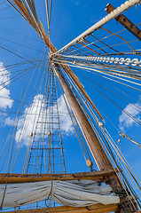 Image showing Folded sail and mast on an old sailboat