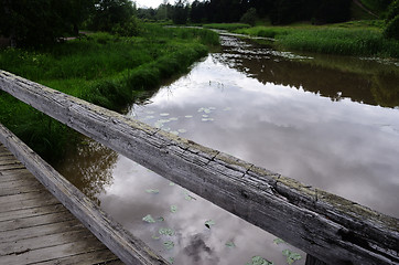 Image showing old wooden bridge over the river