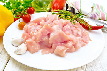 Image showing Chicken breast raw sliced in plate on light board