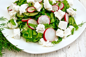 Image showing Salad with spinach and cheese in plate on board