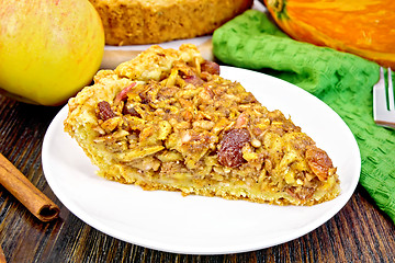 Image showing Pie with pumpkin and apples in plate on board