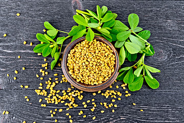 Image showing Fenugreek with leaf in bowl on board top