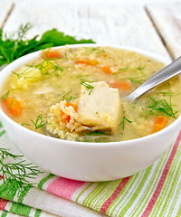 Image showing Soup fish with millet and spoon on white board