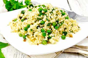 Image showing Couscous with spinach in plate on napkin