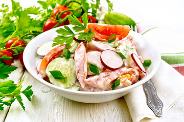 Image showing Salad from fresh vegetables and greens in plate on board