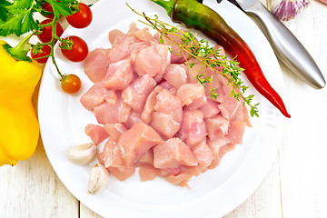 Image showing Chicken breast raw sliced in plate on board top