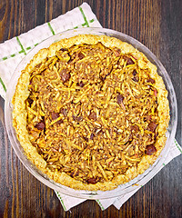 Image showing Pie with pumpkin and apples in pan on board top