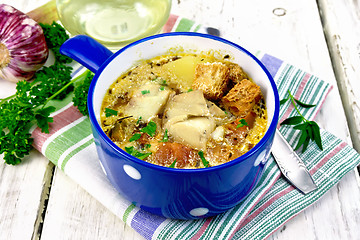 Image showing Soup fish with vegetables and croutons on light board