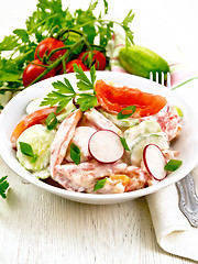 Image showing Salad from fresh vegetables in plate on board