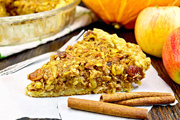 Image showing Pie with pumpkin and apples on parchment