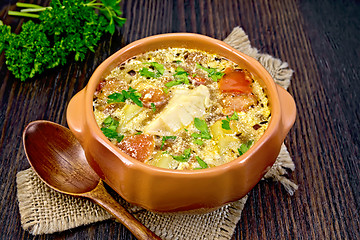 Image showing Soup fish with vegetables and herbs on board