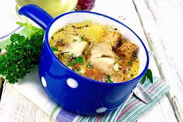 Image showing Soup fish with vegetables and cream on light board